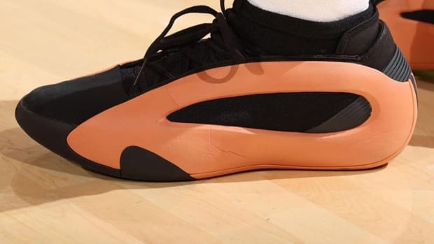 Los Angeles Clippers guard James Harden's black and orange adidas sneakers.